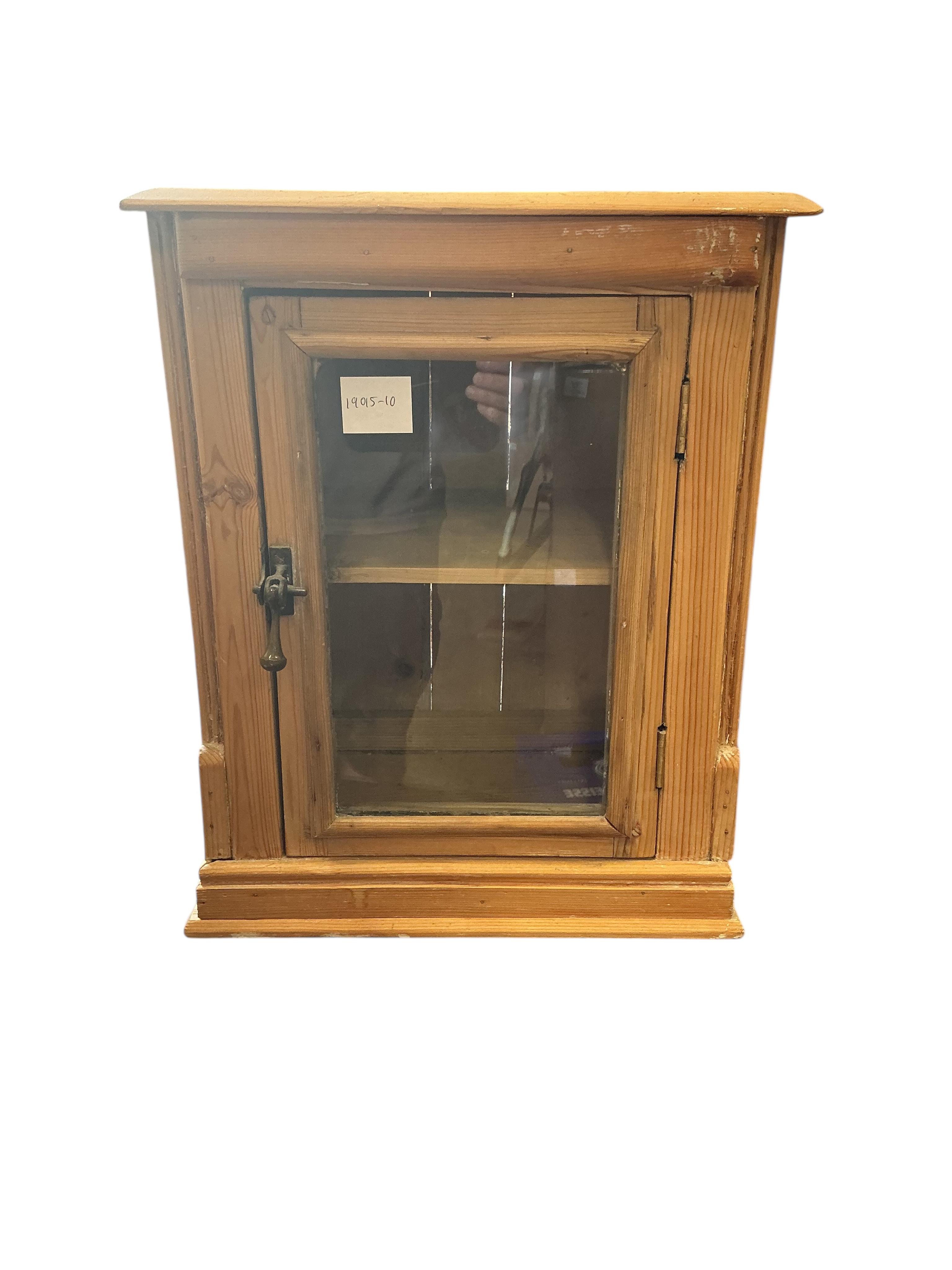 A small 19th century glazed pine table top cabinet, width 37cm, depth 29cm, height 46cm